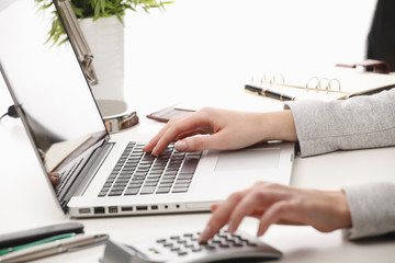Businesswoman calculating datas
