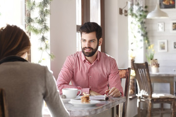 Young man sitting in coffee shop