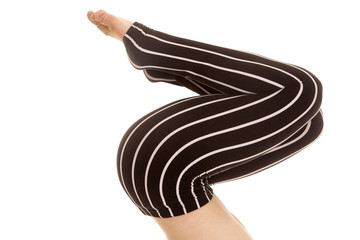 black pants striped legs knees bent