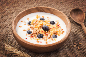 Muesli with yogurt and fresh blueberries. Healthy breakfast