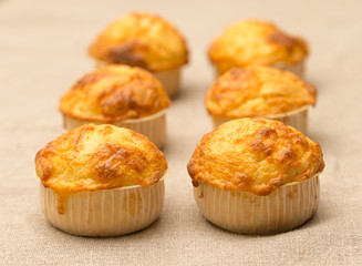 cheese muffins on the background of flax