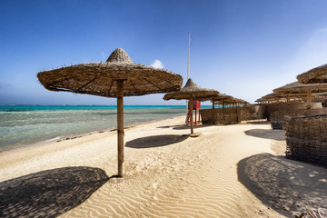 sunbeds and beach umbrella in Marsa Alam, Egypt