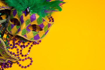 Colorful group of Mardi Gras or venetian mask on yellow - obrazy, fototapety, plakaty