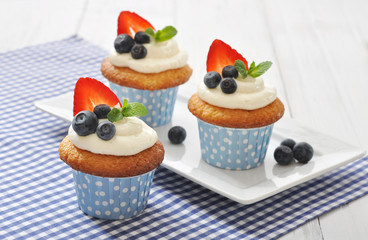 Cupcakes decorated with fresh berries