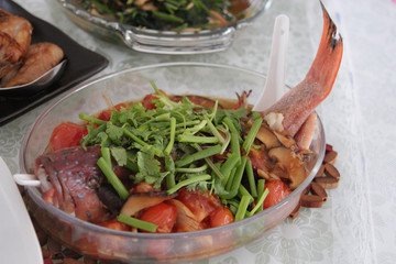 Steamed fish arranged on a glass platter