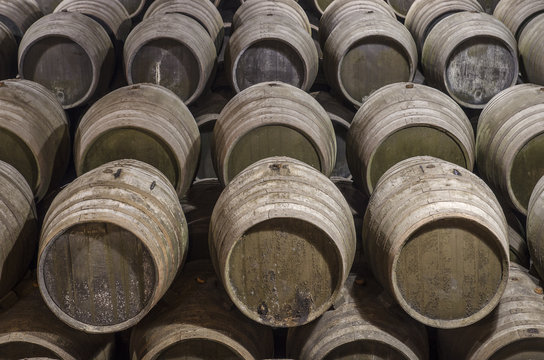Wine barrels stacked in winery