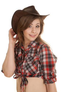 cowgirl hat plaid shirt hand behind hat