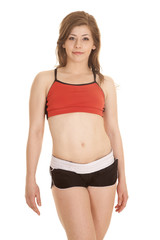 Obraz premium woman shorts and red sports bra stand