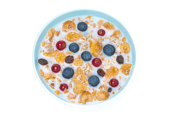 muesli with fresh berries and milk, top view, isolated