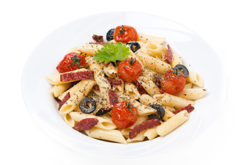 pasta with sausage, cherry tomatoes and olives, isolated