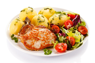 Grilled steak, boiled potatoes and vegetable salad