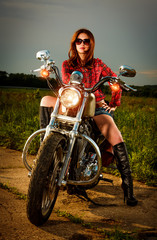 Fototapeta na wymiar Biker girl and motorcycle