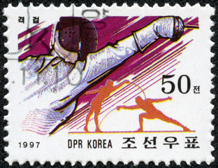 stamp printed in North Korea showing fencing