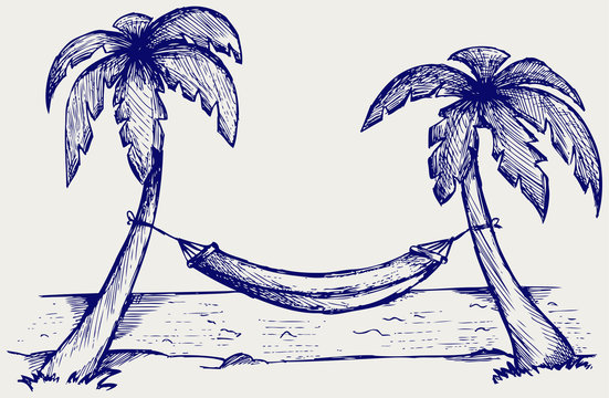 Romantic hammock between palm trees