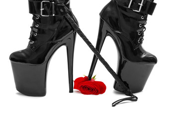 Woman in latex high heels boots stomping rose