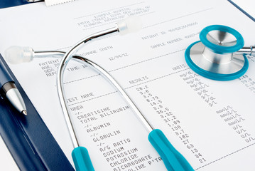 Blood test results in a clipboard with stethoscope