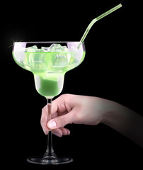 Cocktail Smoothie, with slices of kiwi on a black