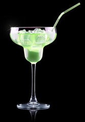 Cocktail Smoothie, with slices of kiwi on a black