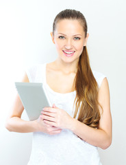 Fototapeta premium young woman holding tablet computer