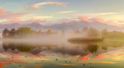 Naklejka premium Autumn landscape and foggy lake