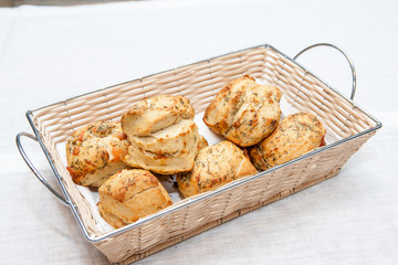 Crusty bread rolls with fresh tomato garnish