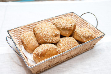 Crusty bread rolls with fresh sesame garnish