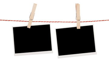 Blank photos hanging on clothesline