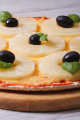 Pizza with pineapple rings  close-up