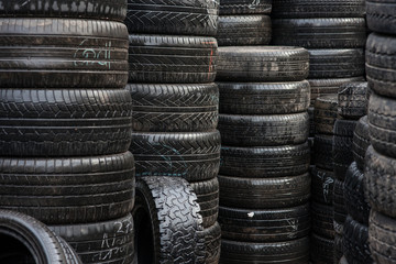 Car tyres stacked in a tyre distribution centre