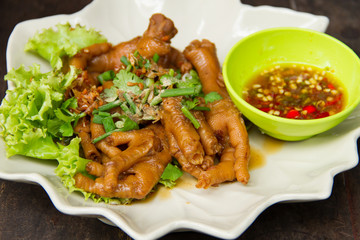 Chicken foot braised in a white plate