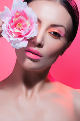 Fototapeta premium beautiful woman with stylish make-up and bright flowers