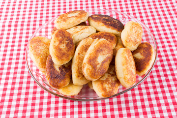 potato patties in a glass dish