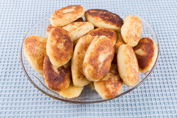 potato patties in a glass dish