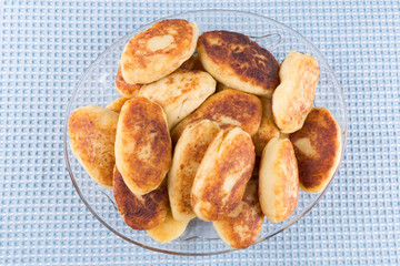 potato patties in a glass dish