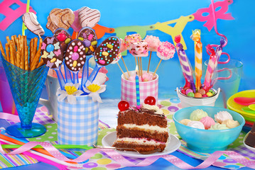 birthday party table with torte and  sweets for kids