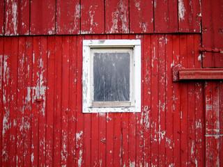 Obraz na płótnie Canvas Barn Window faded weathered and old