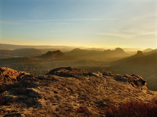 Spring daybreak. Sandstone peaks increased from foggy background