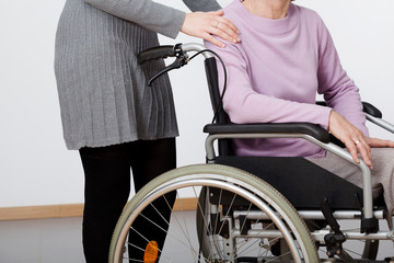 Daughter and her mom on wheelchair