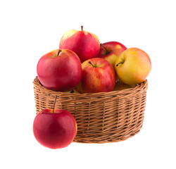 Apples in a wooden basket, isolated on white background.