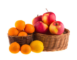 Naklejka na ściany i meble Fresh apples, tangerines and lemons in a wooden basket