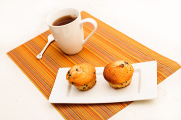 Vanilla with chocolate chips Muffins with a cup of tea