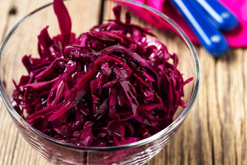 Red coleslaw on wooden background