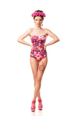 girl with a wreath of flowers on her head on white background