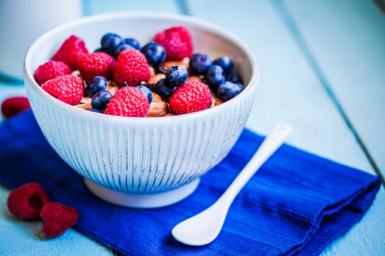 Granola with berries and almonds in a bowl