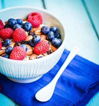 Granola with berries and almonds in a bowl