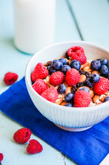 Granola with berries and almonds in a bowl