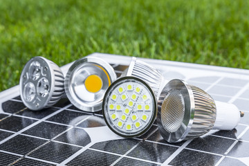 various GU10 LED bulbs on photovoltaics in the grass
