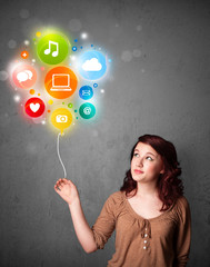 Woman holding social media balloon