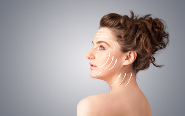 Beautiful girl with facial arrows on her skin