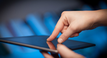 Finger pointing on tablet pc with empty space